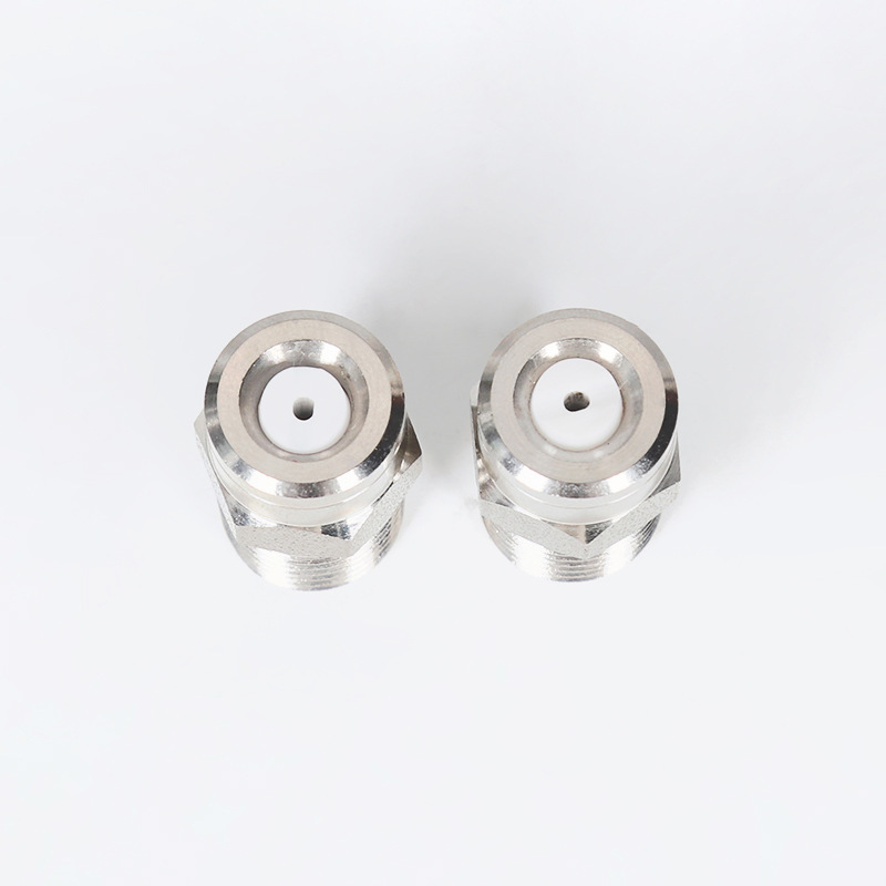 Spolande dammkotte som atomiserar munstycket